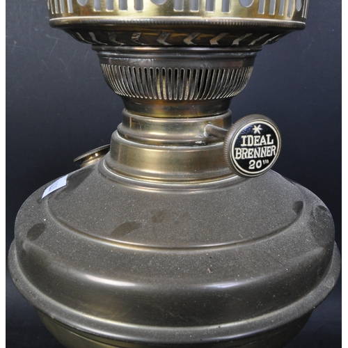 1687 - A Victorian 19th Century brass oil lamp. Having a brass fuel chamber supported on central column wit... 