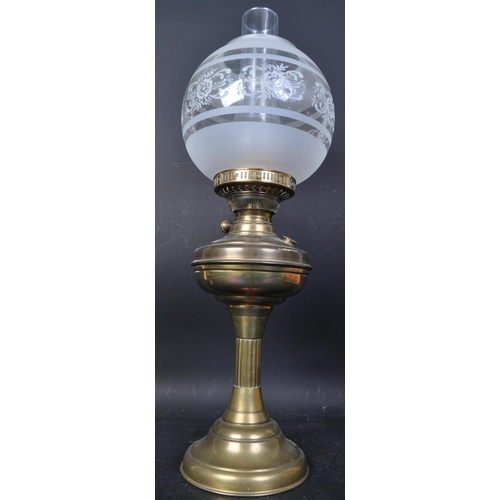 1687 - A Victorian 19th Century brass oil lamp. Having a brass fuel chamber supported on central column wit... 