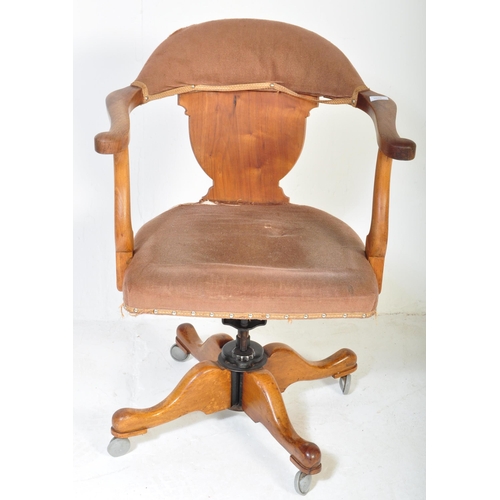 1688 - A vintage 1920's oak office / factory Industrial swivel chair having arched back with scrolled elbow... 