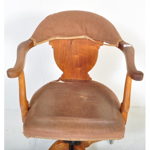 1688 - A vintage 1920's oak office / factory Industrial swivel chair having arched back with scrolled elbow... 