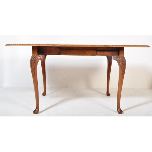 1692 - A 20th century Queen Anne Revival burr walnut drop leaf extending dining table having a straight top... 