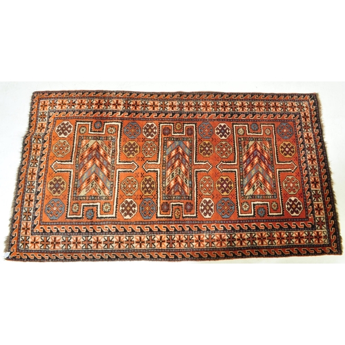 1817 - A vintage mid 20th century Persian Islamic Goltoch wool floor carpet rug with central geometric meda... 