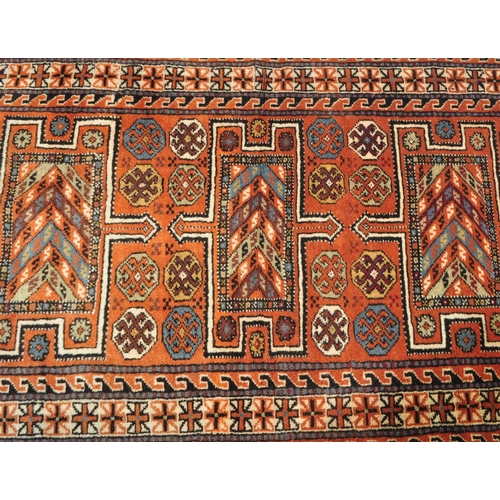 1817 - A vintage mid 20th century Persian Islamic Goltoch wool floor carpet rug with central geometric meda... 