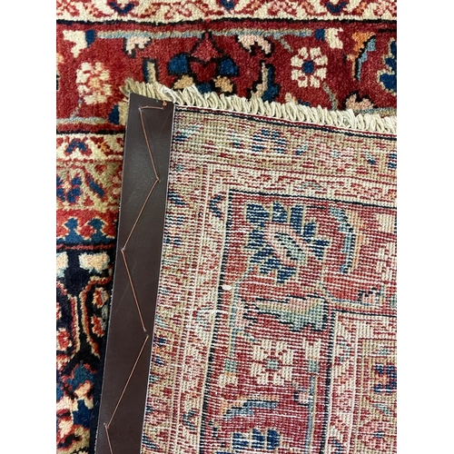 1819 - An early 20th century Persian Islamic North West Sarouk floor carpet rug having a central medallion ... 