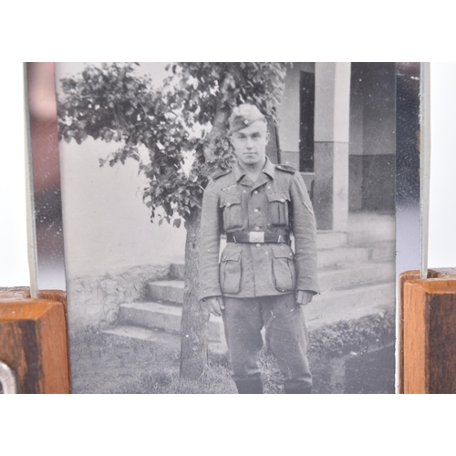 129 - A WWII Second World War Third Reich Nazi German desk top framed photograph of a uniformed soldier. T... 