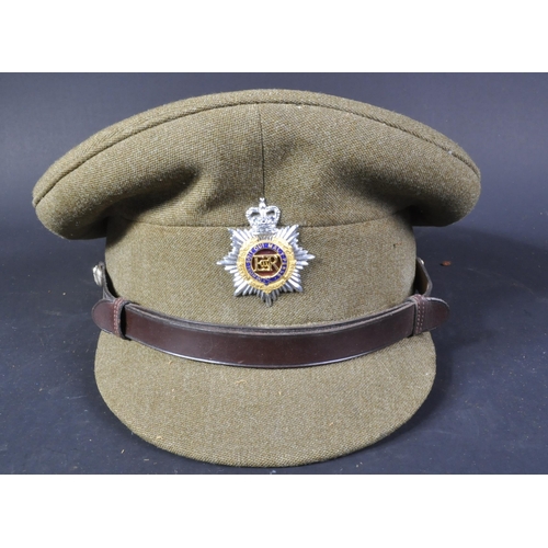 137 - A post war vintage Royal Army Service Corps officers dress uniform peaked cap. Khaki twilled wool wi... 