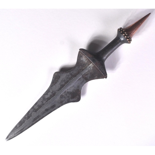 153 - An early 19th Century Central African / Congolese tribal dagger. The dagger having a copper dome sha... 