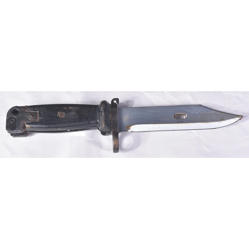 157 - An original vintage Kalashnikov AKM rifle bayonet. The bayonet having a serrated edge to the back of... 