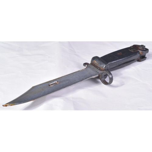 157 - An original vintage Kalashnikov AKM rifle bayonet. The bayonet having a serrated edge to the back of... 