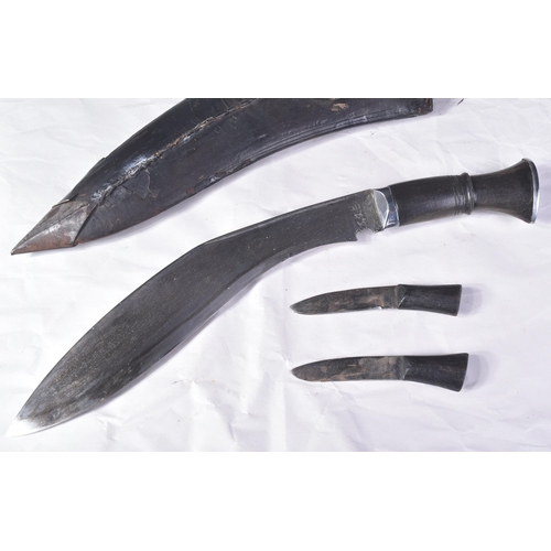 168 - A vintage Nepalese / Gurkha Regiment Kukri knife dagger. The knife having a pommel with diamond shap... 