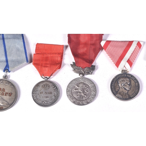 214 - A collection of assorted European First and Second World War (and other) military campaign medals co... 