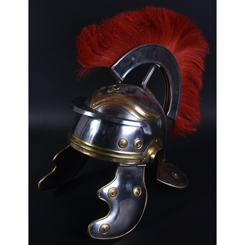 216 - A 20th Century Roman Centurion / Gladiator reenactment Galea helmet. The helmet of steel and brass c... 