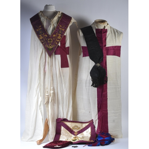 236 - An original Masonic Knights Templar uniform regalia comprising mantle and tunic, maroon velvet cap, ... 