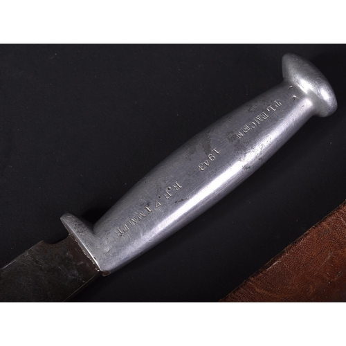 250 - A WWII Second World War US United States trench fighting knife. The alloy hilt stamped  ' Tlemcen 19... 