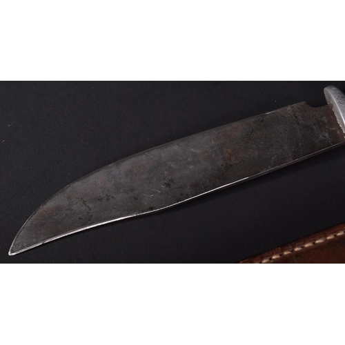 250 - A WWII Second World War US United States trench fighting knife. The alloy hilt stamped  ' Tlemcen 19... 