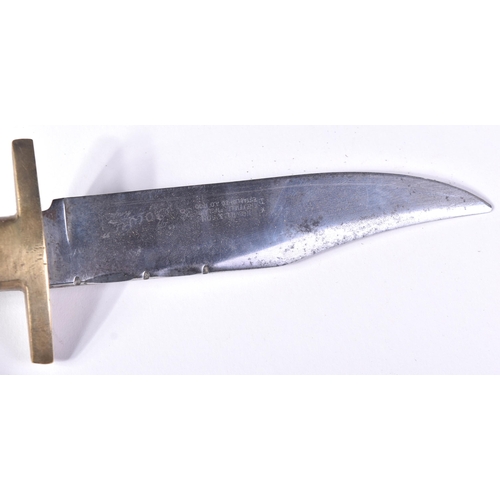 294 - A vintage J. Nowill & Sons of Sheffield made bowie knife. The knife having a wooden grip with finger... 