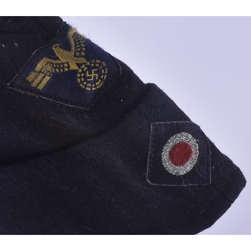 433 - A WWII Second World War Third Reich Nazi German Kriegsmarine sidecap. Blue wool with a front Eagle S... 