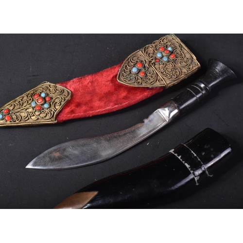 442 - Two miniature Nepalese / Gurkha interest Kukri knives. One a bone hilted example with brass blade ho... 