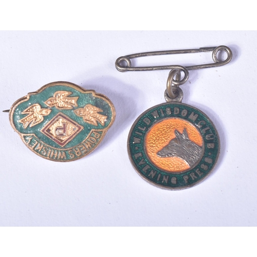 443 - Badges - a collection of x3 c1930s enamel badges, to include; a Powers Whiskey badge in green enamel... 