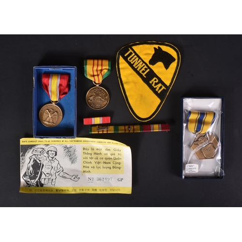 463 - Vietnam War - a collection of items relating to the conflict to include; a Tunnel Rat cloth uniform ... 