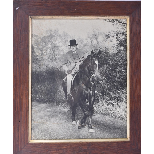 528 - Winston Churchill (1874-1965) - an original large format press photograph showing Churchill on horse... 