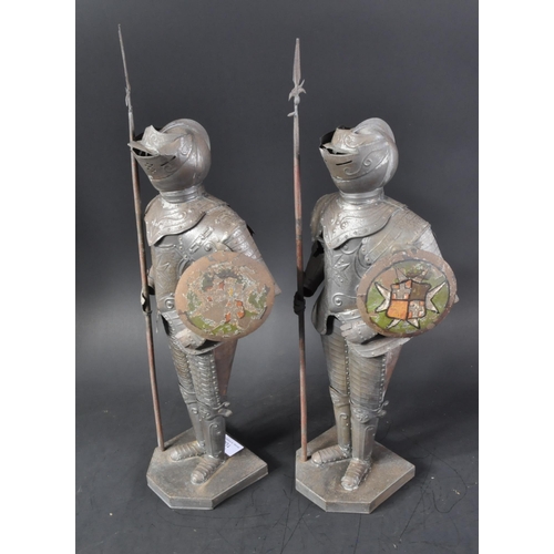 106 - A pair of vintage 20th Century pressed metal Maltese Knight figurines. The armoured figures with pol... 