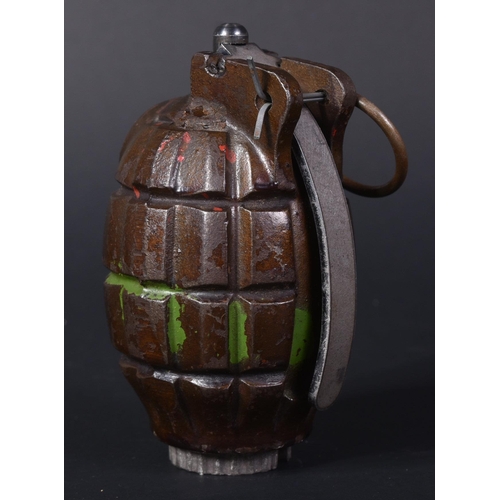 12 - An original WWII Second World War British Army issue No. 36 Mills Bomb hand grenade. Inert, but a co... 