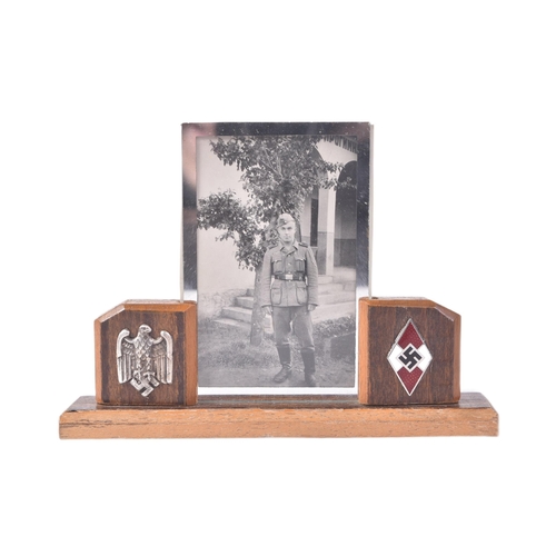 129 - A WWII Second World War Third Reich Nazi German desk top framed photograph of a uniformed soldier. T... 