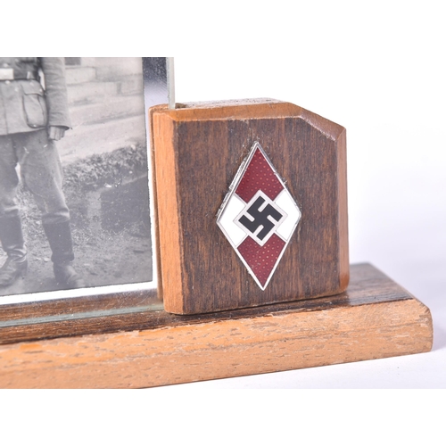 129 - A WWII Second World War Third Reich Nazi German desk top framed photograph of a uniformed soldier. T... 