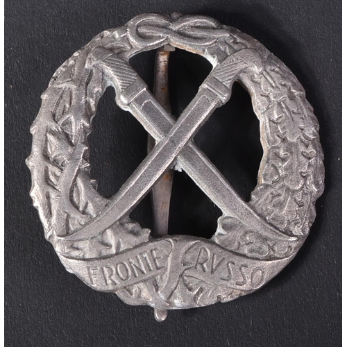 138 - A WWII Second World War Italian Fascist Front Russian / Russo badge. The silver colour badge depicti... 