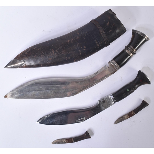 139 - Two vintage Nepalese / Gurkha Regiment Kukri knife dagger. Both examples with white metal capped pom... 