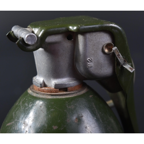 145 - An original Vietnam War era US United States M26 (inert) hand grenade. The grenade with a smooth cas... 