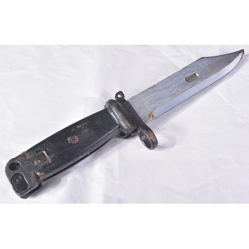 157 - An original vintage Kalashnikov AKM rifle bayonet. The bayonet having a serrated edge to the back of... 