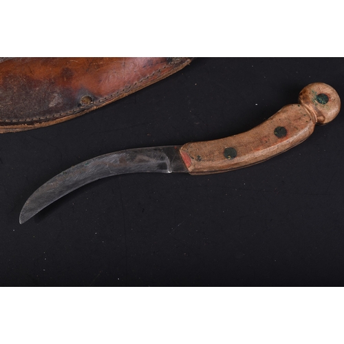 177 - A WWII Second World War RAF Royal Air Force Aircrew escape knife. The wooden handle with a curved bl... 