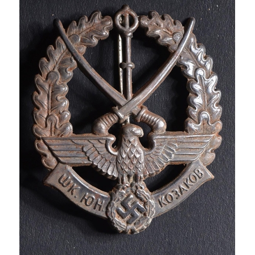 196 - A WWII Second World War Third Reich Nazi German / Young Russian Cossacks badge. The badge depicting ... 