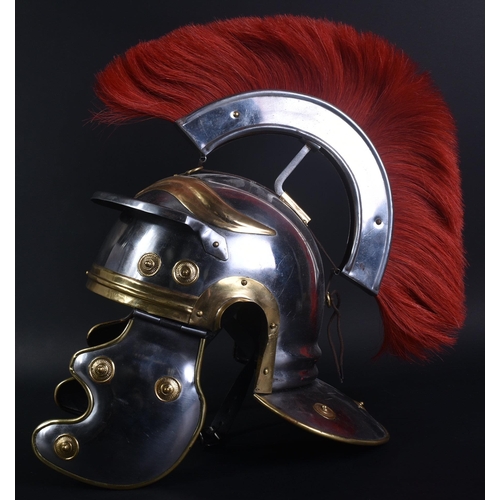 216 - A 20th Century Roman Centurion / Gladiator reenactment Galea helmet. The helmet of steel and brass c... 