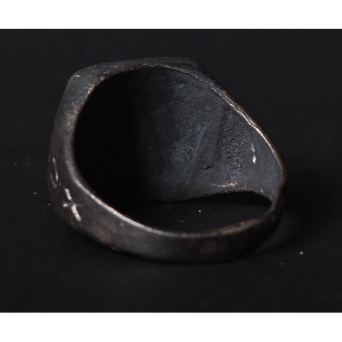 229 - A WWII Second World War Italian Fascist's ring depicting an embossed bust of a helmeted Benito Musso... 