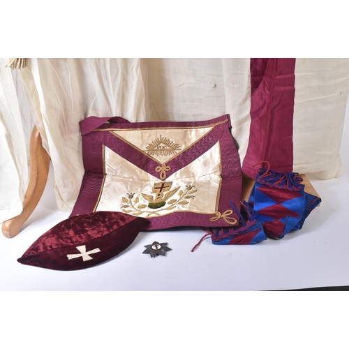 236 - An original Masonic Knights Templar uniform regalia comprising mantle and tunic, maroon velvet cap, ... 