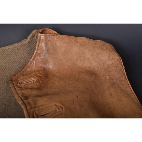 24 - An original WWII Second World War 1942 dated British Army Officers brown leather jerkin. The single-... 