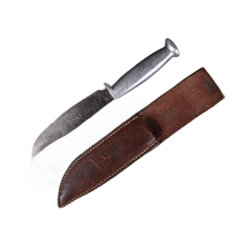 250 - A WWII Second World War US United States trench fighting knife. The alloy hilt stamped  ' Tlemcen 19... 