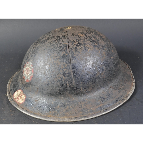 28 - A WWII Second World War British National Fire Service brodie helmet. The helmet of usual form with h... 