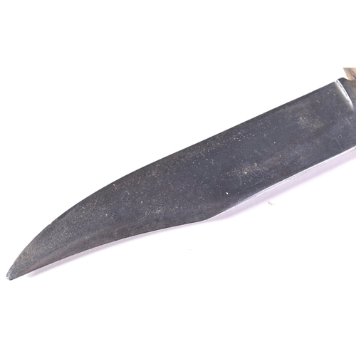 294 - A vintage J. Nowill & Sons of Sheffield made bowie knife. The knife having a wooden grip with finger... 