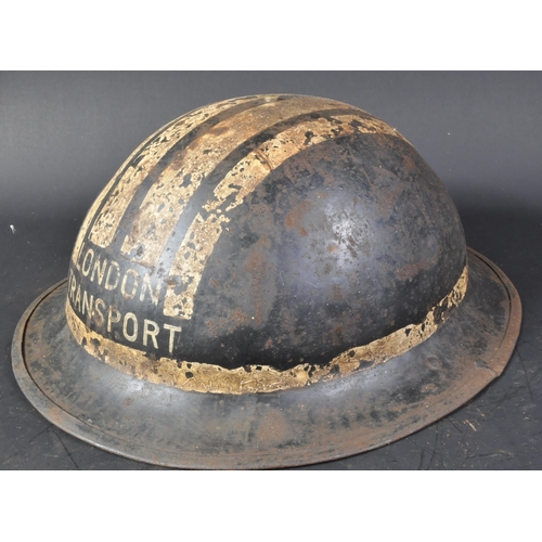 33 - A WWII Second World War British Civil Defence Brodie helmet. Usual form in black, with a leather lin... 