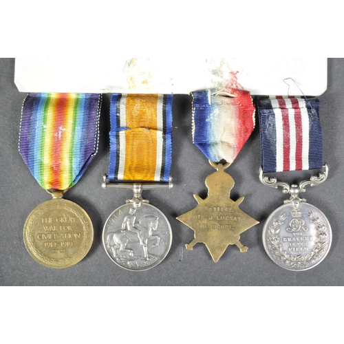 4 - A WWI First World War medal group awarded to one Pte. J. Lindsay of The Royal Highlanders ( Black Wa... 