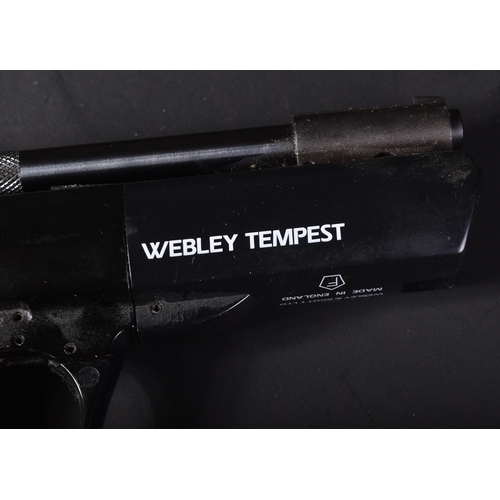 434 - A vintage Webley & Scott Tempest .22 caliber spring powered air pistol. Chequered Bakelite grip with... 