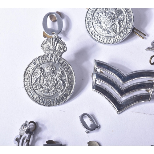 444 - A collection of assorted vintage British Police uniform badges / shoulder titles to include; Metropo... 