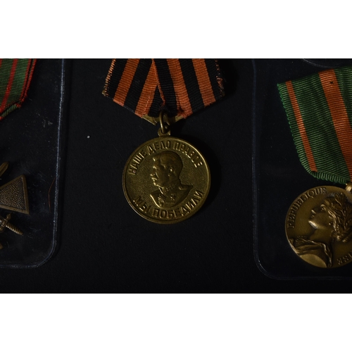 448 - A collection of x10 assorted First World War, Second World War and other period military medals of a... 