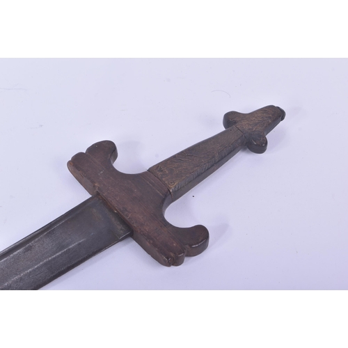 459 - An 18th Century European backsword. Shaped wooden hilt with metal capped pommel and a pipe back blad... 