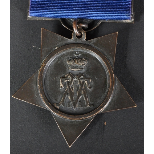 49 - An original 19th Century Egypt Khedive's Star campaign medal with Tokar clasp. The 5 pointed bronze ... 