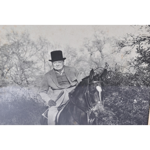 528 - Winston Churchill (1874-1965) - an original large format press photograph showing Churchill on horse... 